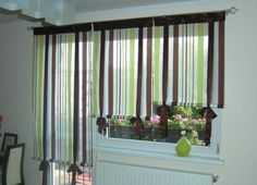 Как выбрать шторы в гостиную с двумя окнами